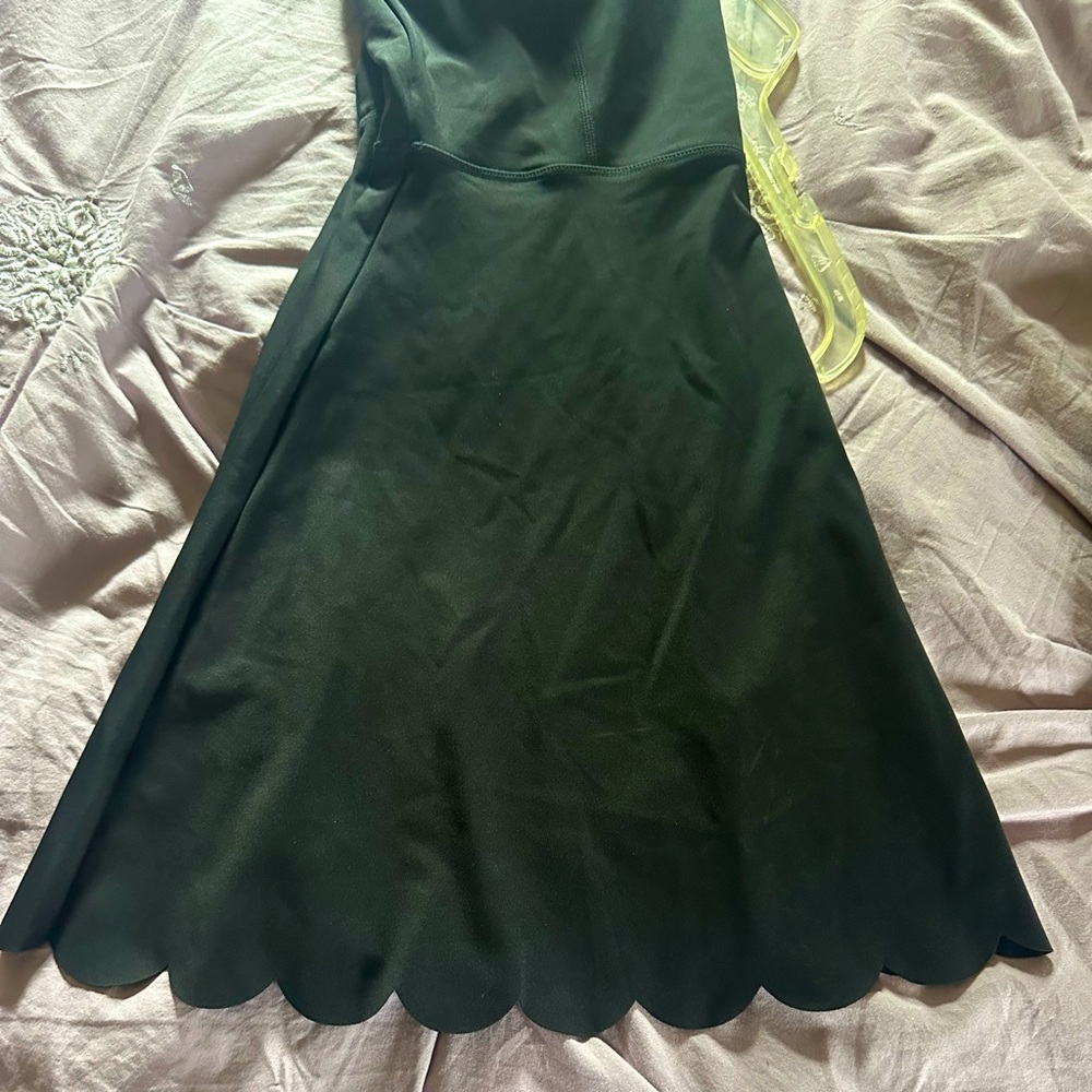 New without tags tennis dress with shorts that go underneath size medium